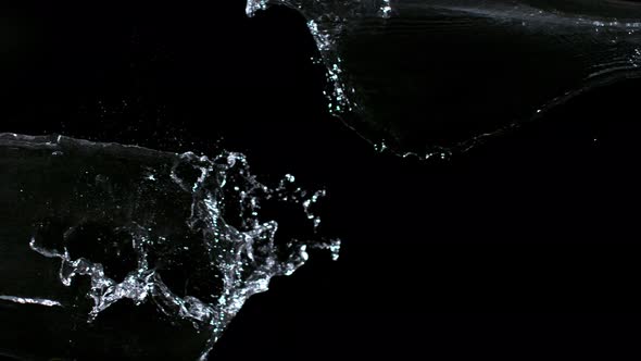 Super Slowmotion Shot of Water Splash Against Black alt