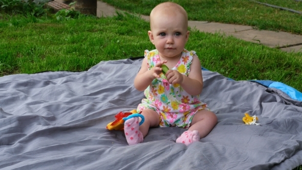 Seven Month Baby Girl With Cucmber Seven Month Baby Girl With Cucmber