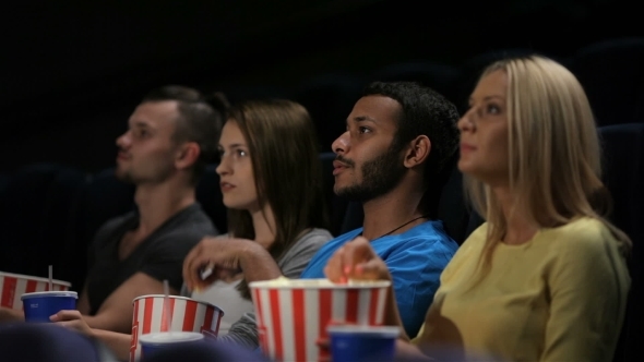Group Of Friends Watching Film In Cinema Group Of Friends Watching Film In Cinema