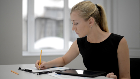 Office Girl Working in Office Using Tablet Office Girl Working in Office Using Tablet