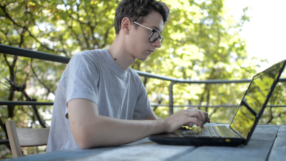 Working on Laptop Keyboard in Morning Working on Laptop Keyboard in Morning