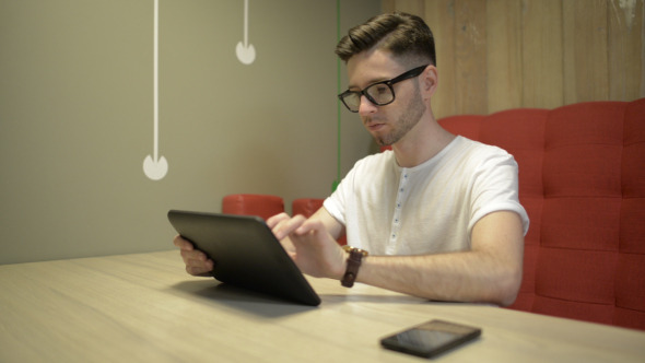 Man Using Tablet Man Using Tablet