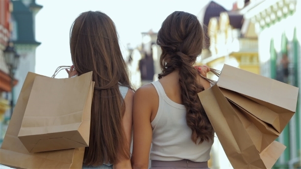 Young Cheerful Girl Shopaholic Posing With Shoppin Young Cheerful Girl Shopaholic Posing With Shoppin
