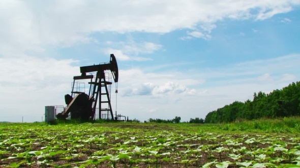 Oil Pump Working While Producing Natural Gas 