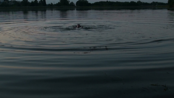 Man Bathes In The Lake