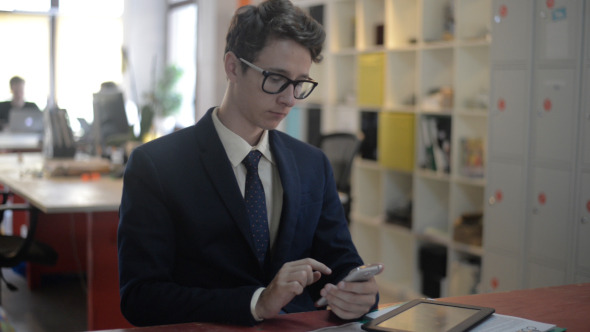 Young Man Using Smartphone Young Man Using Smartphone