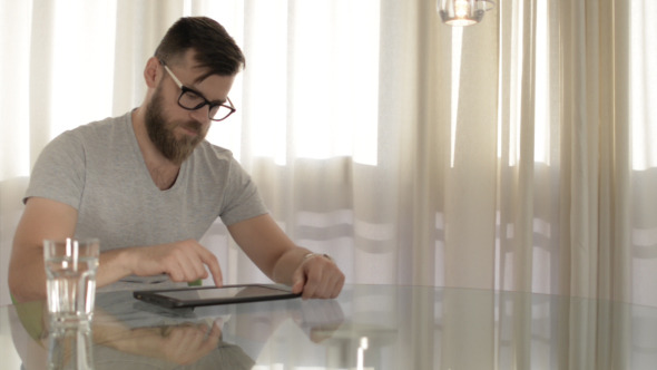 Young Man Using Tablet Young Man Using Tablet