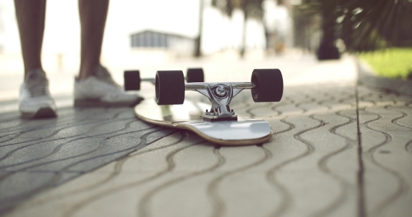 Longboard In Upside Down On a Concrete Ground Longboard In Upside Down On a Concrete Ground