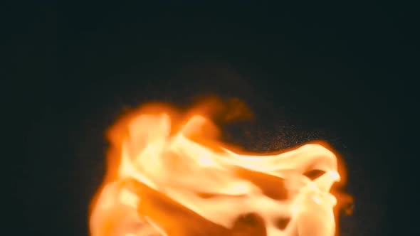 Spurts Of Flame On A Black Background. Slow Mo