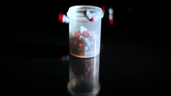 Pills Capsules Falling Into Container 1