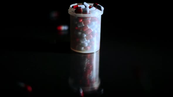Pills Capsules Falling Into Container 2