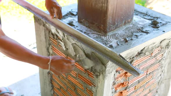 Plastering Concrete Worker At Wall Of House Construction 1 Plastering Concrete Worker At Wall Of House Construction 1