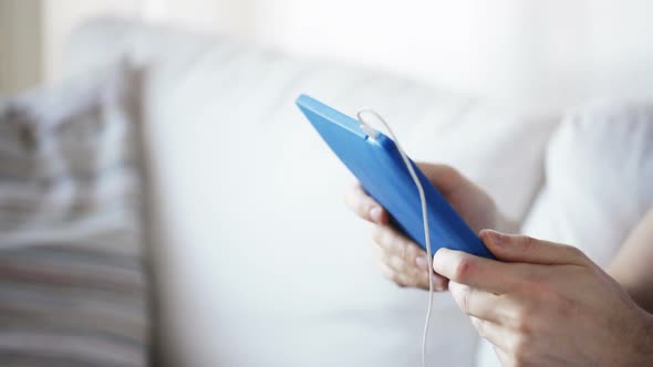 Close Up Of Man With Tablet Pc And Earphones 4 alt
