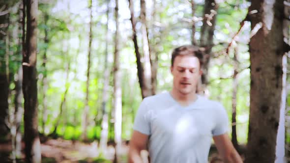 Handsome Man Running Alone In The Forest 2