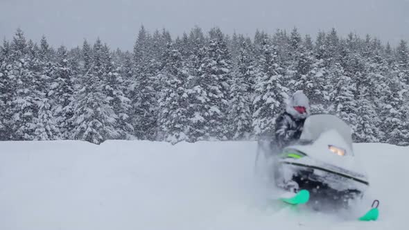 Lonely Man Snowmobiling In The Powder Snow 5