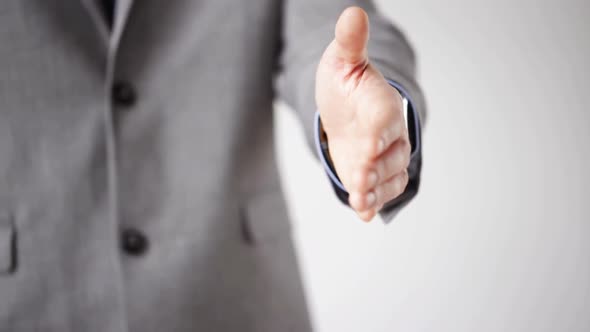 Close Up Of Businessman Giving Hand For Handshake 4 alt
