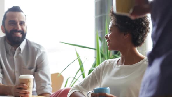 Happy Creative Team Drinking Coffee In Office 22 alt