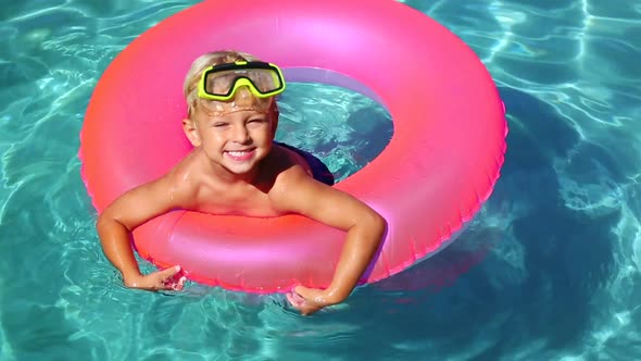 Young Kid Having Fun In Swimming Pool 2