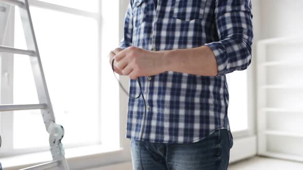 Close Up Of Man Untangling Wires 2 alt