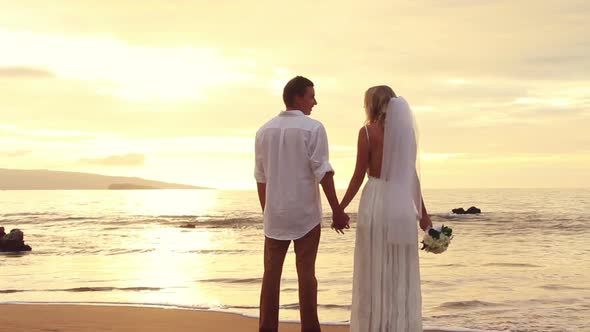Newly Married Couple Kissing On Tropical Beach At Sunset 1
