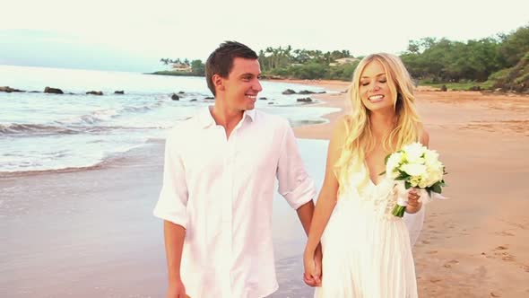 Newly Married Couple On Tropical Beach At Sunset 1