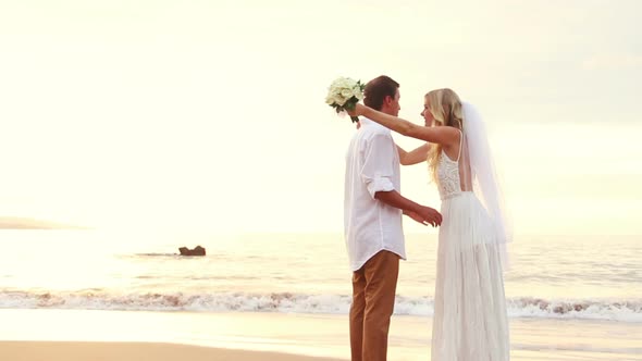 Newly Married Couple On Tropical Beach At Sunset 10
