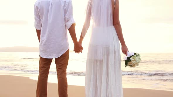 Newly Married Couple On Tropical Beach At Sunset 11