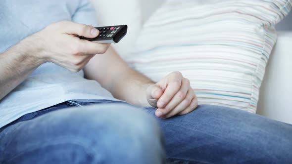Close Up Of Man With Beer And Remote At Home 8 alt