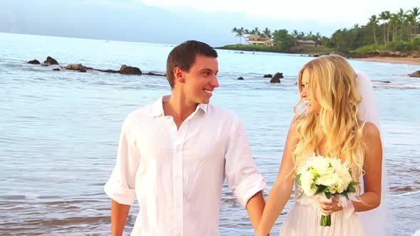 Newly Married Couple On Tropical Beach At Sunset 2