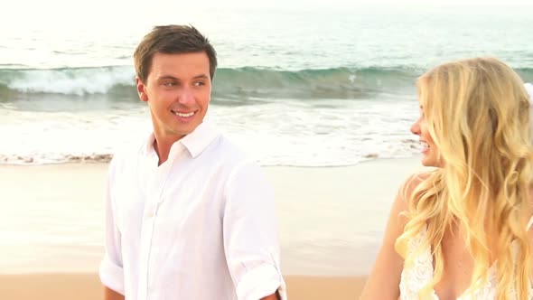Newly Married Couple On Tropical Beach At Sunset 5