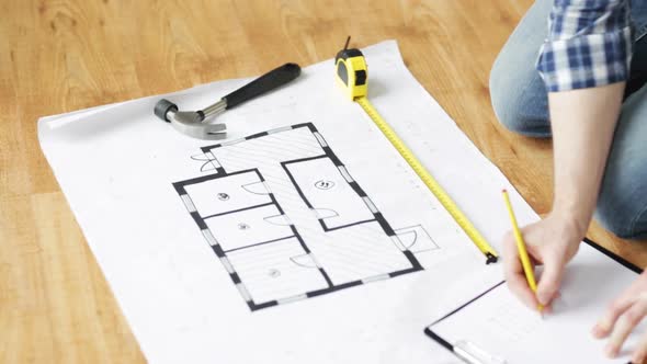 Close Up Of Male Hands Measuring Blueprint 4 alt