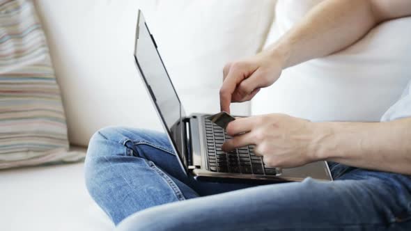 Close Up Of Man With Laptop And Credit Card 5 alt