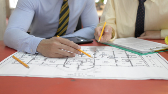 Engineers Working on Blueprint Project Engineers Working on Blueprint Project