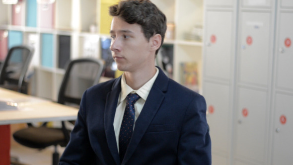 Bored Young Man Sitting in Office Bored Young Man Sitting in Office