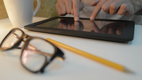 Drinking Coffee and Typing on Tablet Drinking Coffee and Typing on Tablet