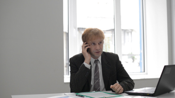 Businessman Talking on Phone Businessman Talking on Phone