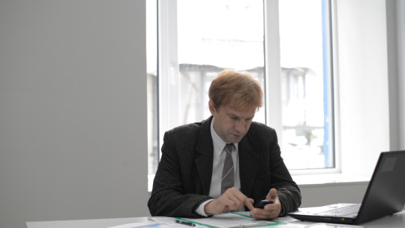 Businessman Using Phone Businessman Using Phone