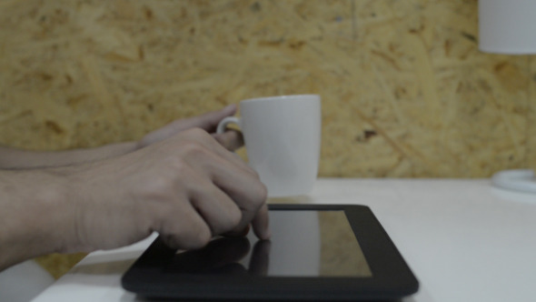 Using Tablet During Office Break Coffee Time Using Tablet During Office Break Coffee Time