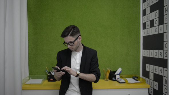 Young Man Using Smartphone Young Man Using Smartphone