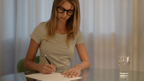 Girl Writing on Paper Girl Writing on Paper