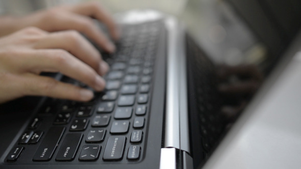 Hands Typing on Keyboard of Laptop Hands Typing on Keyboard of Laptop