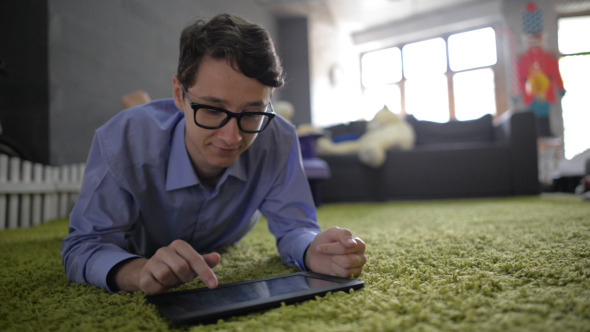 Man Face Reaction, while Using Tablet (2) alt