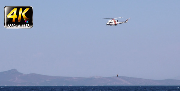 Helicopter is Holding Diver and Sea Helicopter is Holding Diver and Sea
