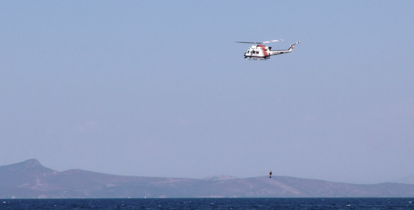 Helicopter is Holding Diver and Sea Helicopter is Holding Diver and Sea