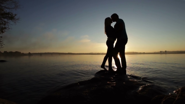 Silhouette Of Couples At Sunset
