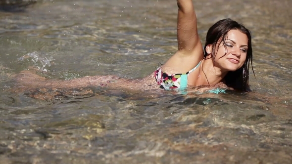 Girl Plops Down In Sea