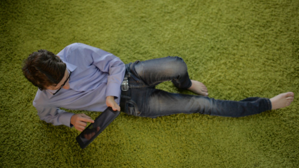 Laying on Carpet Typing on Tablet Laying on Carpet Typing on Tablet