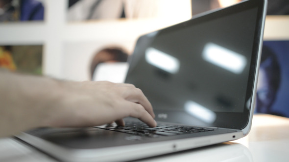Typing on Laptop Keyboard in Office Typing on Laptop Keyboard in Office