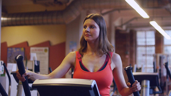 Portrait Of Happy Girl Doing Exercises In Gym