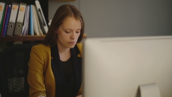 Young Woman Sitting Without Looking Up Young Woman Sitting Without Looking Up